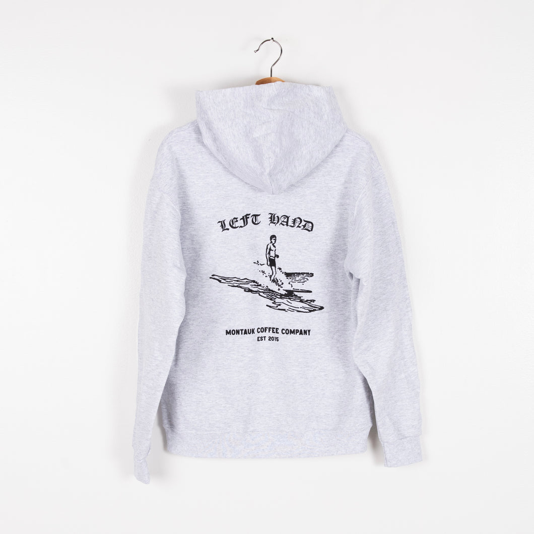Image of a bGray Left Hand Coffee hoodie with a surfer on the back