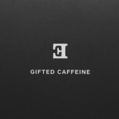close up image of a gift card in black with the reverse letter 'E'
