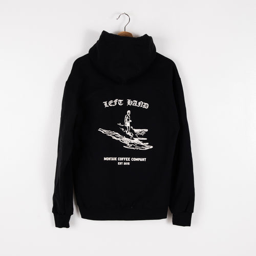 Image of a black Left Hand Coffee hoodie with a surfer on the back