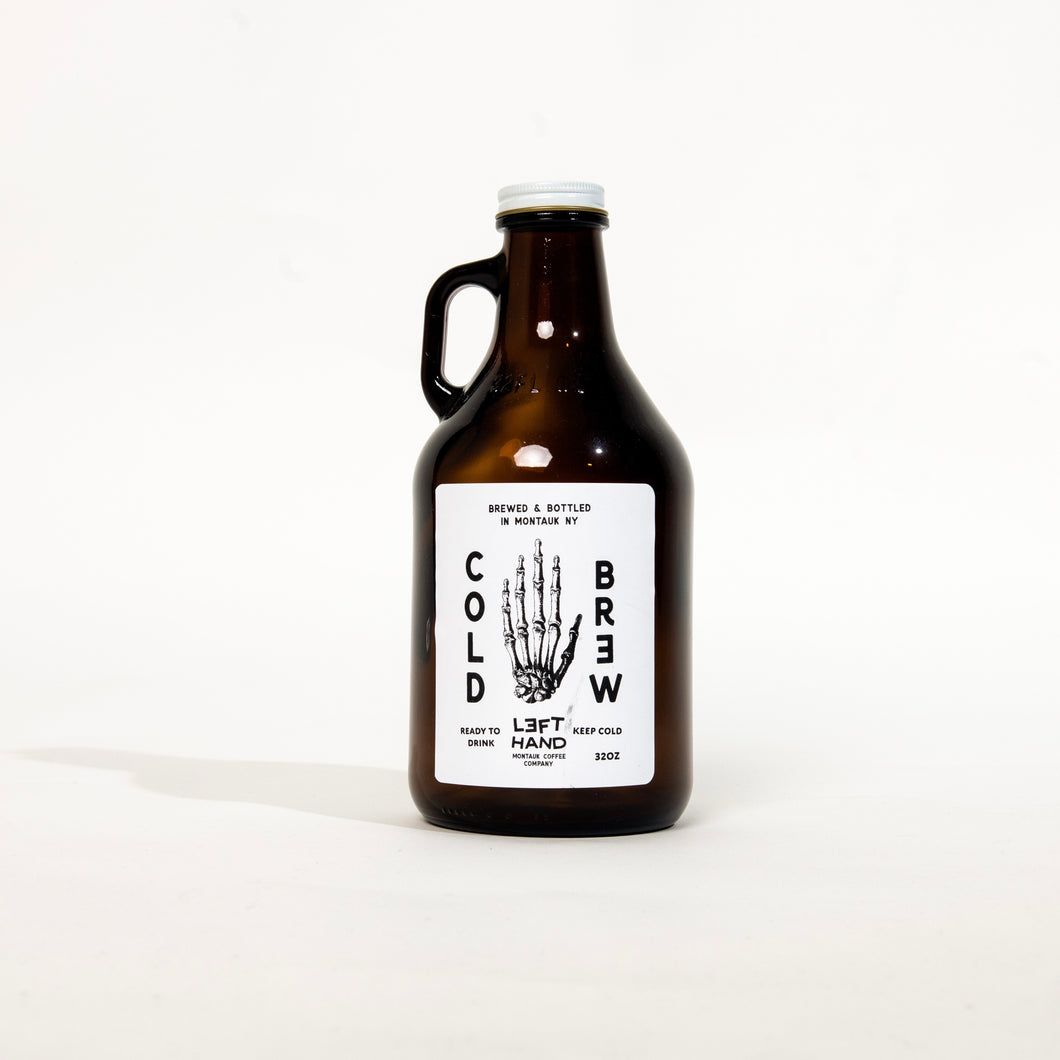 Image of a cold brew growler with a white label featuring the skeleton of a left hand